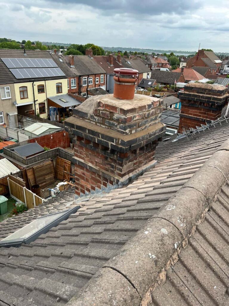 This is a photo taken from a roof which is being repaired by Warsop Roofing Repairs, it shows a street of houses, and their roofs